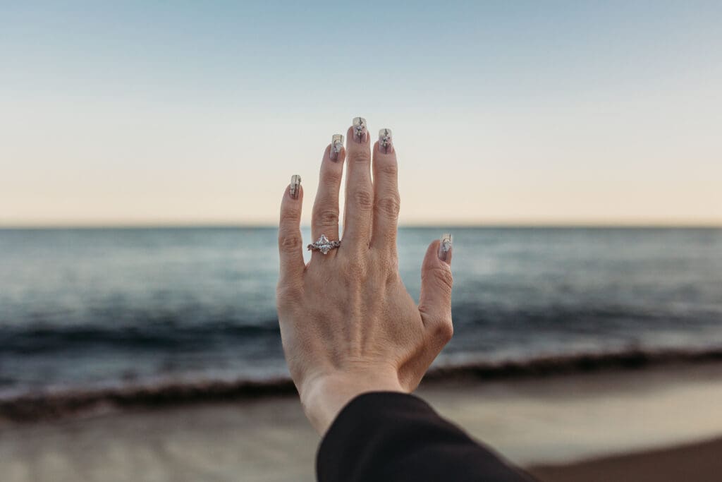 Engagement ring with Malibu beach and ocean in the background