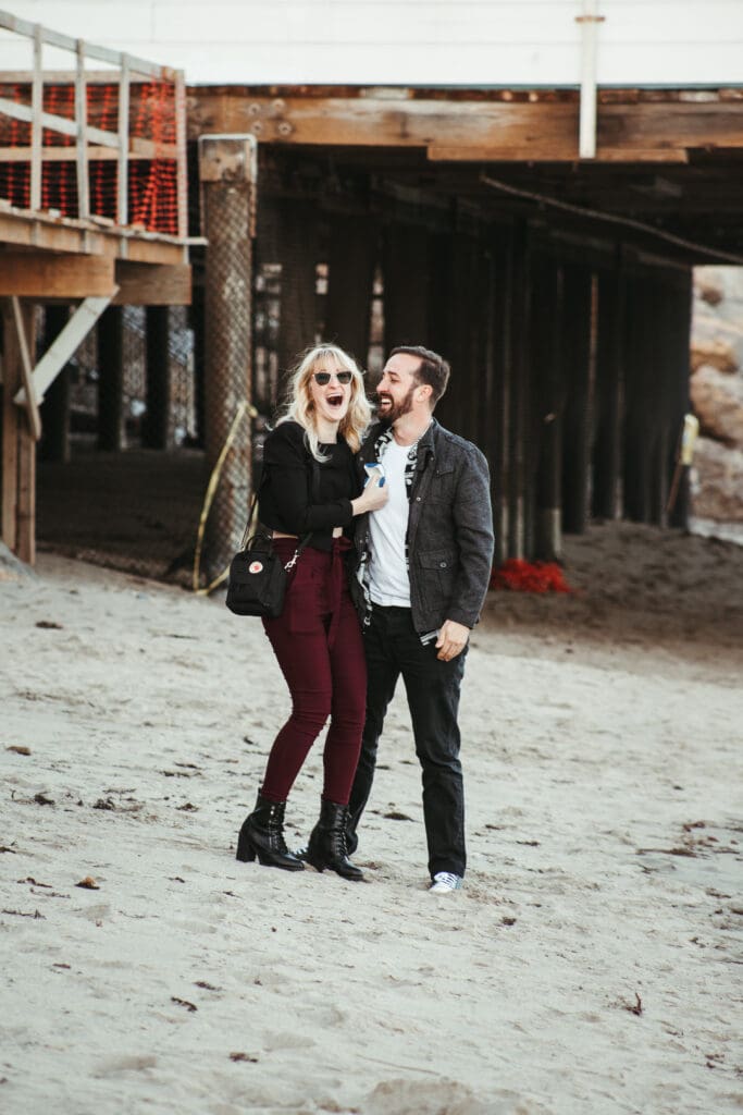 Couple getting engaged on the beach in Malibu, California